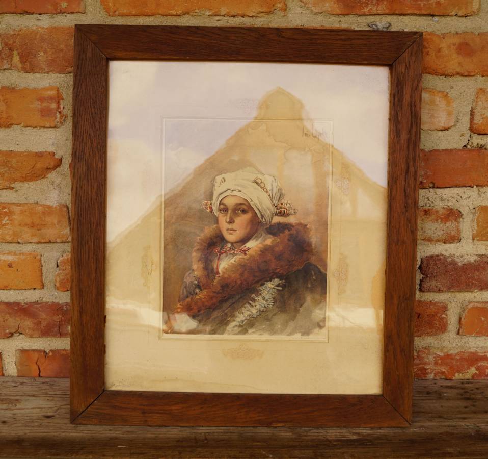 Dřevěný rám s obrázkem ženy v kroji